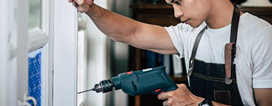 Professional window repair - Image of technician repairing window.